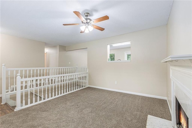 7420 Bristol Cir, Douglasville, GA 30134 - unfurnished room featuring ceiling fan, a fireplace with flush hearth, and carpet
