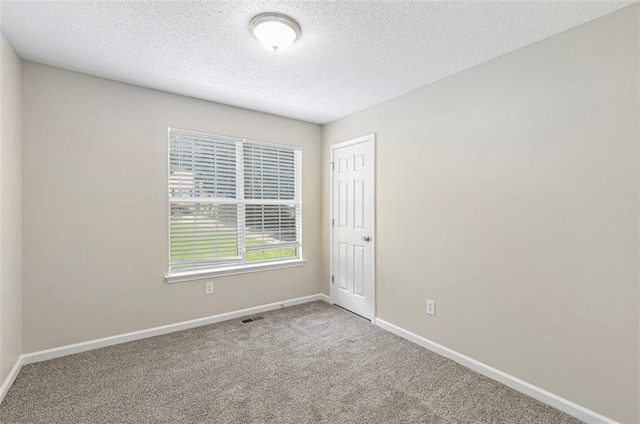 7420 Bristol Cir, Douglasville, GA 30134 - carpeted spare room with baseboards and a textured ceiling