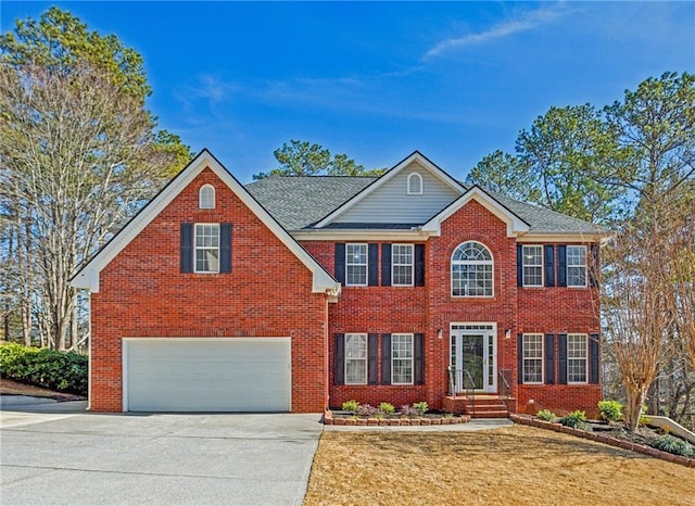 colonial-style house featuring a garage