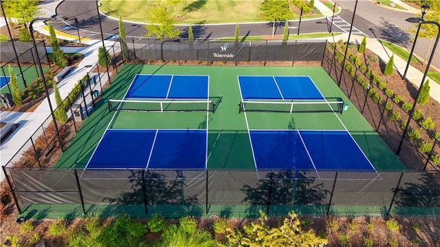 view of sport court with fence