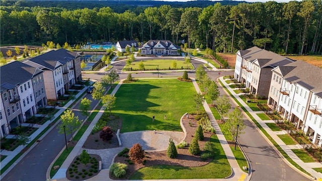 birds eye view of property with a forest view