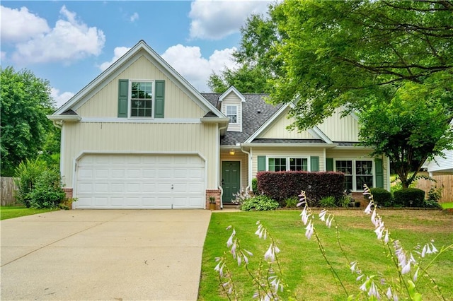 5279 Leecroft Dr, Buford, GA 30518 - view of front of property with driveway, a garage, brick siding, and roof with shingles