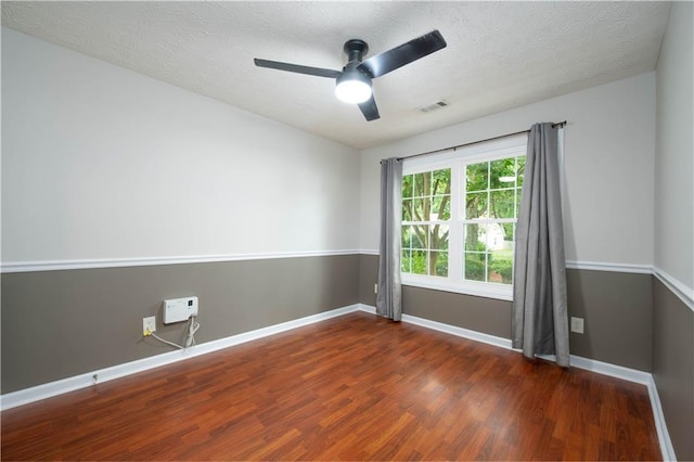 5279 Leecroft Dr, Buford, GA 30518 - unfurnished room with wood finished floors, a ceiling fan, and a textured ceiling