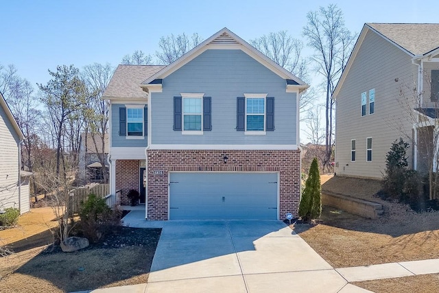 view of front facade featuring a garage, concrete driveway, and brick siding