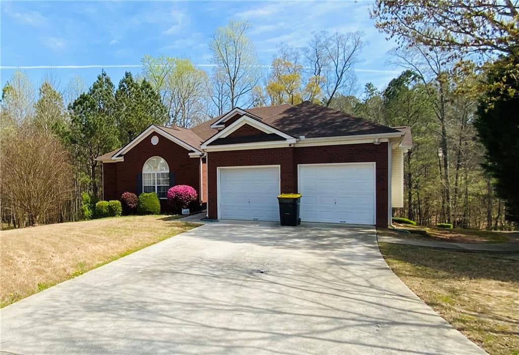 ranch-style house featuring a garage