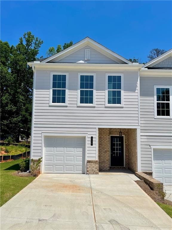 115 Greenview Ct, Homer, GA 30547 - view of front of home featuring a garage, concrete driveway, and brick siding