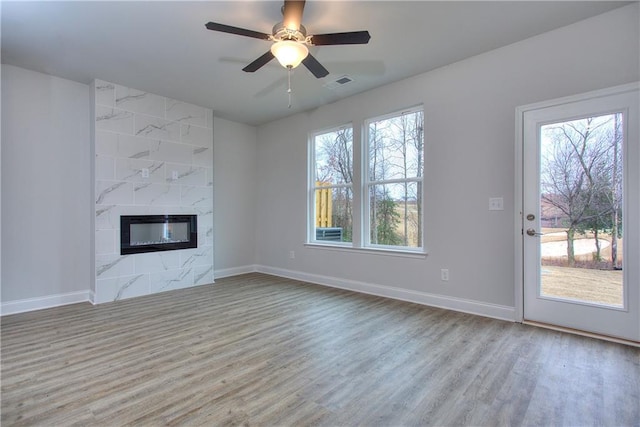 115 Greenview Ct, Homer, GA 30547 - unfurnished living room with wood finished floors, a high end fireplace, and ceiling fan