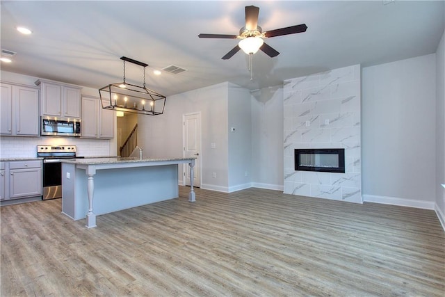 115 Greenview Ct, Homer, GA 30547 - kitchen with appliances with stainless steel finishes, gray cabinets, light wood finished floors, and recessed lighting