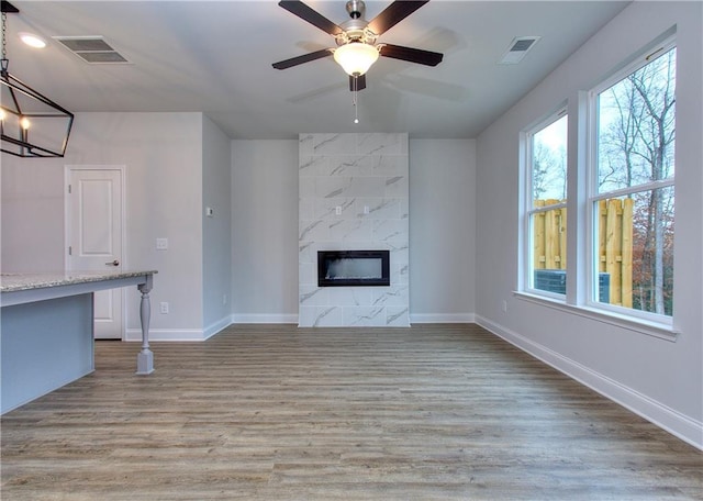 115 Greenview Ct, Homer, GA 30547 - unfurnished living room with a fireplace, wood finished floors, and ceiling fan