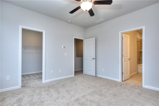 115 Greenview Ct, Homer, GA 30547 - unfurnished bedroom with carpet floors, a spacious closet, a closet, connected bathroom, and a ceiling fan