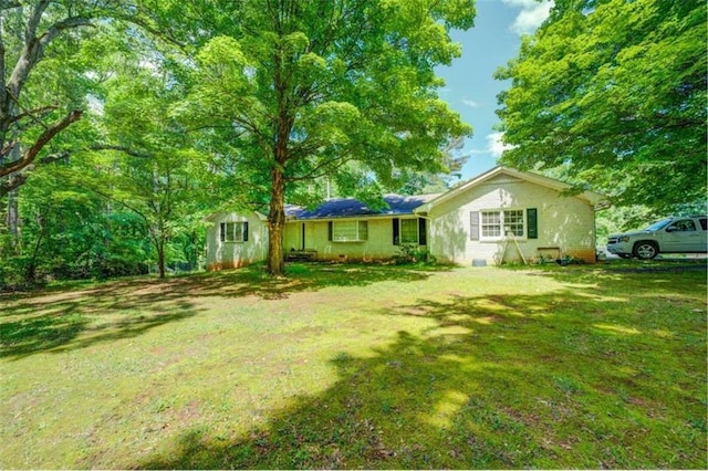 view of front of property with a front yard and crawl space