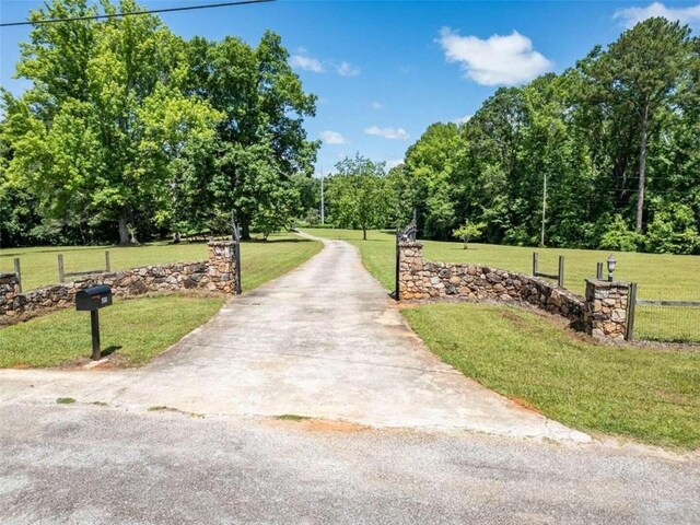 surrounding community featuring a yard