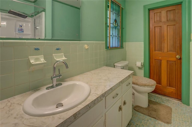 500 Cochran Rd, Covington, GA 30014 - full bathroom with toilet, vanity, wainscoting, and tile walls