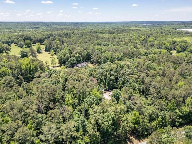 drone / aerial view featuring a view of trees