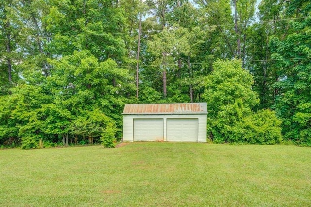 500 Cochran Rd, Covington, GA 30014 - view of grassy yard with an outdoor structure and a garage