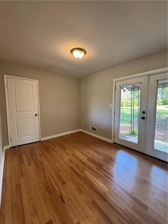 2069 Bixler Cir, Decatur, GA 30032 - unfurnished room featuring baseboards, hardwood / wood-style floors, and visible vents