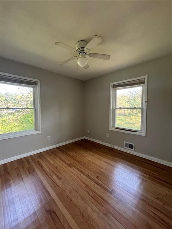 2069 Bixler Cir, Decatur, GA 30032 - spare room with visible vents, baseboards, plenty of natural light, and wood finished floors