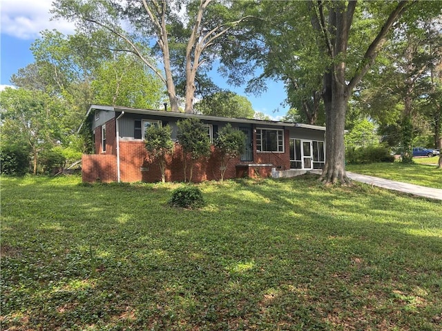 2069 Bixler Cir, Decatur, GA 30032 - ranch-style home featuring brick siding and a front lawn