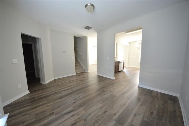 empty room with dark hardwood / wood-style floors