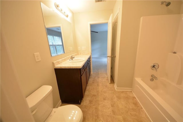 full bathroom featuring vanity, bathing tub / shower combination, and toilet