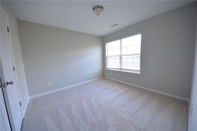 view of carpeted spare room