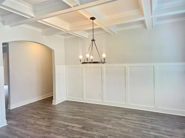 195 Silvercrest Dr, Acworth, GA 30101 - unfurnished dining area with a decorative wall, arched walkways, coffered ceiling, beam ceiling, and a chandelier