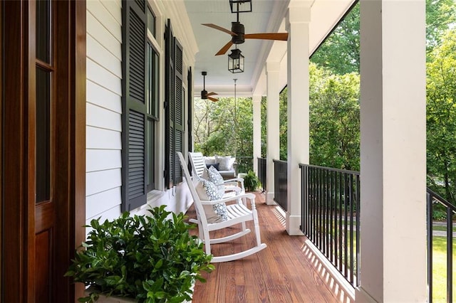 balcony with a porch and ceiling fan
