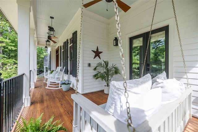 deck with a porch and a ceiling fan