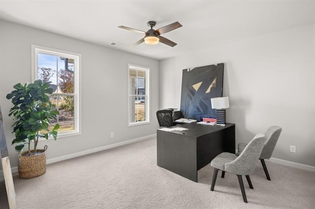 carpeted office with ceiling fan