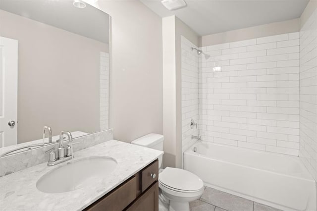 full bathroom with vanity, tiled shower / bath combo, tile patterned floors, and toilet