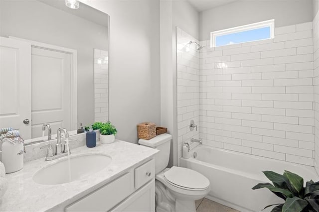 full bathroom featuring vanity, toilet, and tiled shower / bath combo