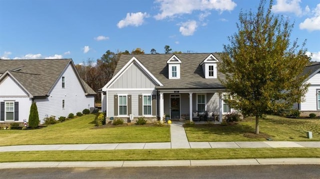 view of front of property featuring a porch and a front lawn