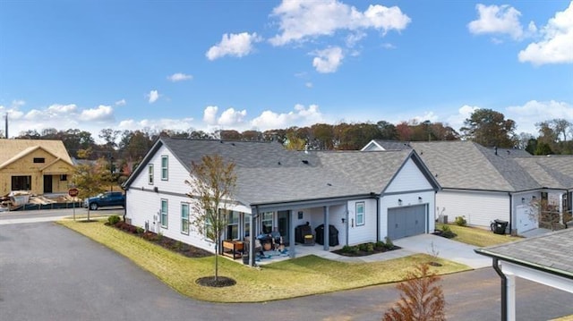 view of front of house featuring a garage and a front yard