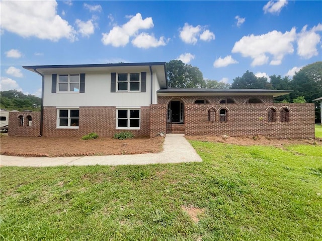 1710 Fontaine Dr, Jonesboro, GA 30236 - split level home featuring a front lawn and brick siding