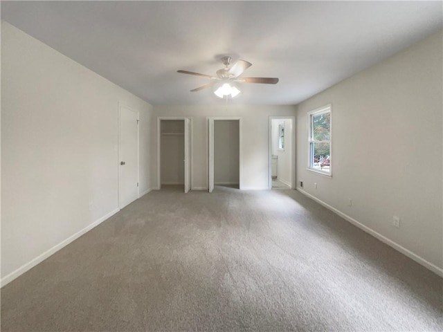 1710 Fontaine Dr, Jonesboro, GA 30236 - unfurnished bedroom featuring baseboards, carpet flooring, a ceiling fan, and multiple closets