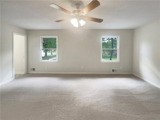1710 Fontaine Dr, Jonesboro, GA 30236 - carpeted spare room featuring healthy amount of natural light, ceiling fan, and baseboards