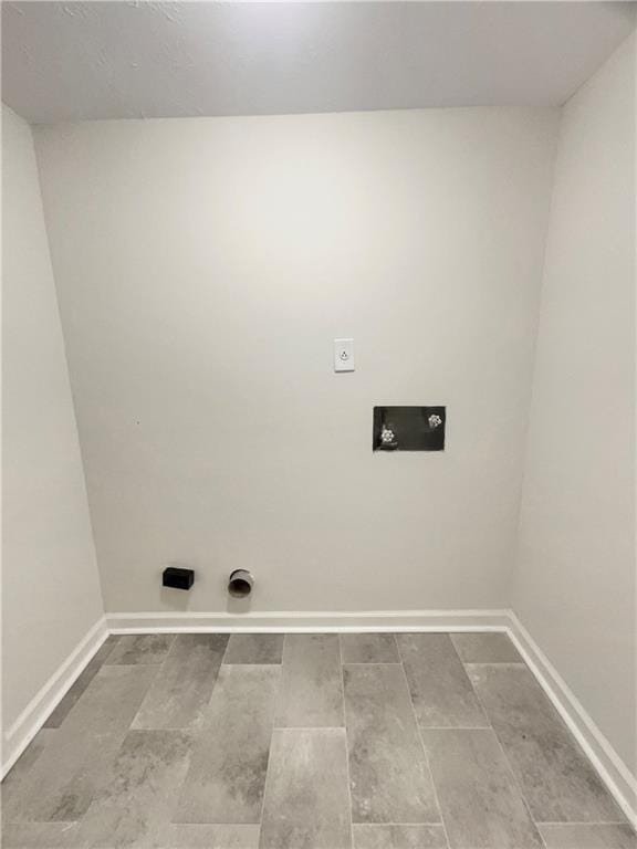 1710 Fontaine Dr, Jonesboro, GA 30236 - washroom featuring electric dryer hookup, baseboards, wood tiled floors, and hookup for a washing machine