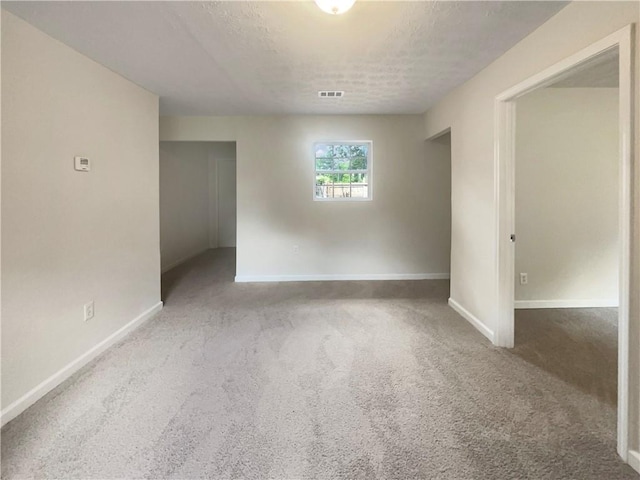 1710 Fontaine Dr, Jonesboro, GA 30236 - carpeted empty room with baseboards and a textured ceiling