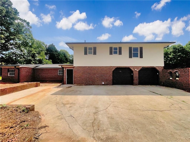 1710 Fontaine Dr, Jonesboro, GA 30236 - view of front of home with an attached garage, brick siding, and concrete driveway