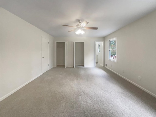 1710 Fontaine Dr, Jonesboro, GA 30236 - unfurnished bedroom with baseboards, light carpet, and a ceiling fan