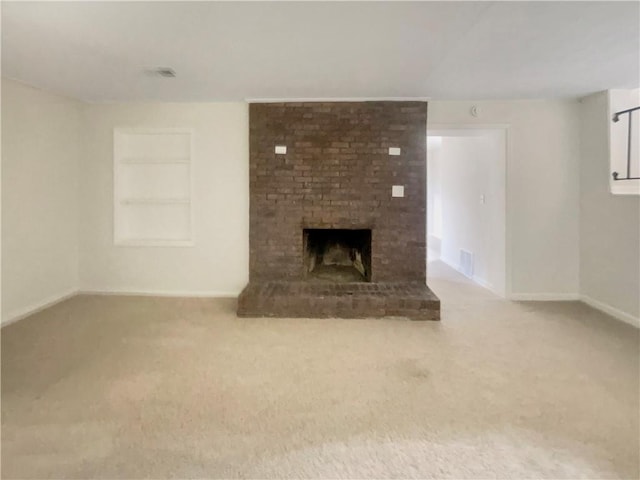 1710 Fontaine Dr, Jonesboro, GA 30236 - unfurnished living room featuring a fireplace, carpet floors, built in features, and baseboards