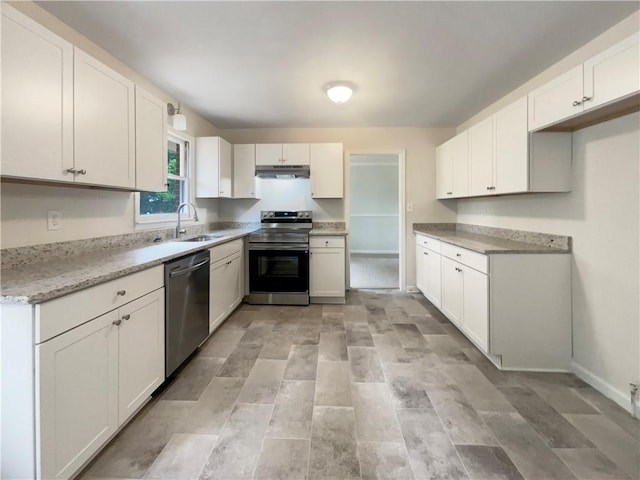 1710 Fontaine Dr, Jonesboro, GA 30236 - kitchen with stainless steel appliances, under cabinet range hood, a sink, and white cabinets