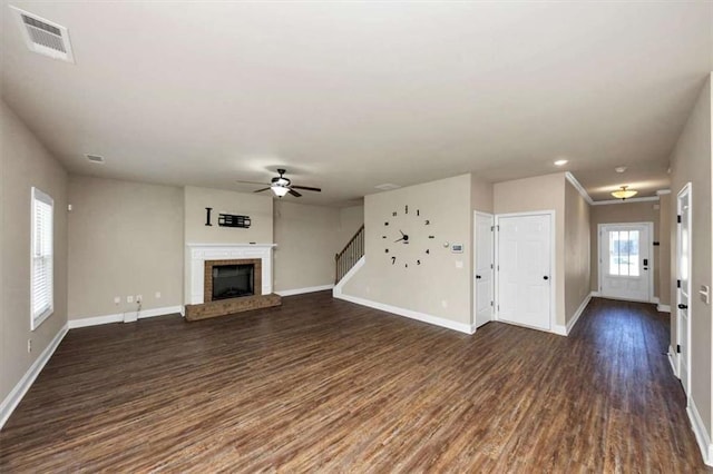 2375 Walker Dr, Hampton, GA 30228 - unfurnished living room with visible vents, baseboards, a brick fireplace, dark wood-style flooring, and a ceiling fan