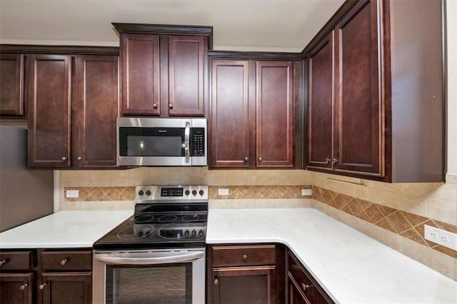 2375 Walker Dr, Hampton, GA 30228 - kitchen with appliances with stainless steel finishes, light countertops, and backsplash