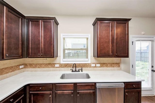2375 Walker Dr, Hampton, GA 30228 - kitchen with dark brown cabinetry, dishwasher, light countertops, and a sink