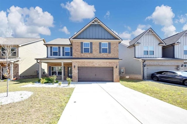 2375 Walker Dr, Hampton, GA 30228 - craftsman-style home with a front yard, an attached garage, board and batten siding, concrete driveway, and brick siding
