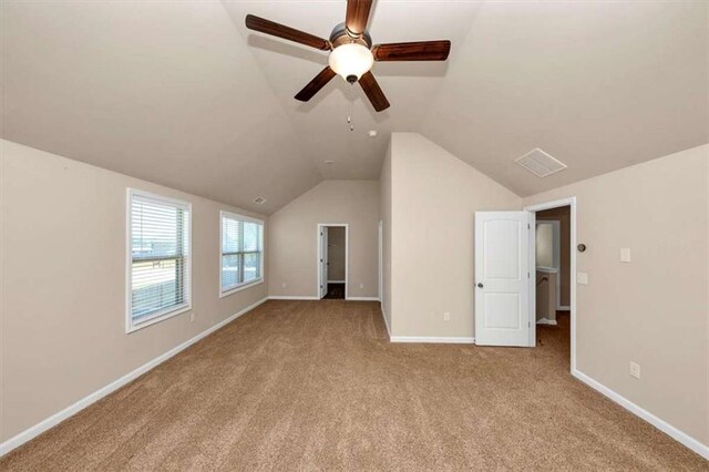 2375 Walker Dr, Hampton, GA 30228 - interior space with a ceiling fan, baseboards, vaulted ceiling, and carpet