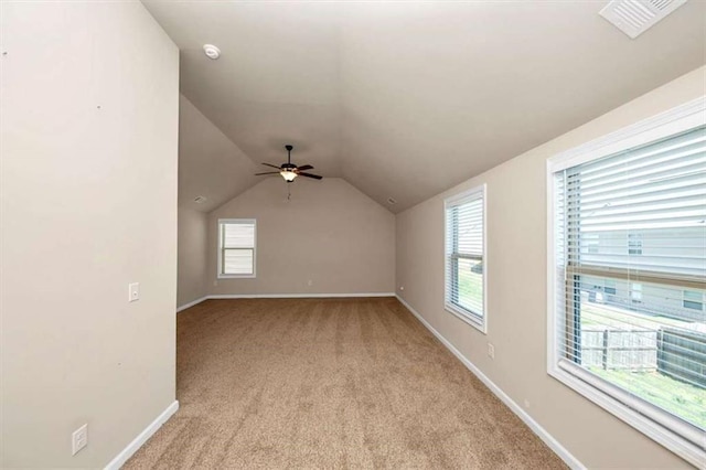 2375 Walker Dr, Hampton, GA 30228 - additional living space featuring baseboards, a ceiling fan, visible vents, lofted ceiling, and light colored carpet