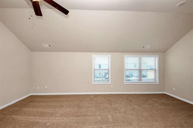 2375 Walker Dr, Hampton, GA 30228 - empty room featuring visible vents, carpet flooring, baseboards, and lofted ceiling