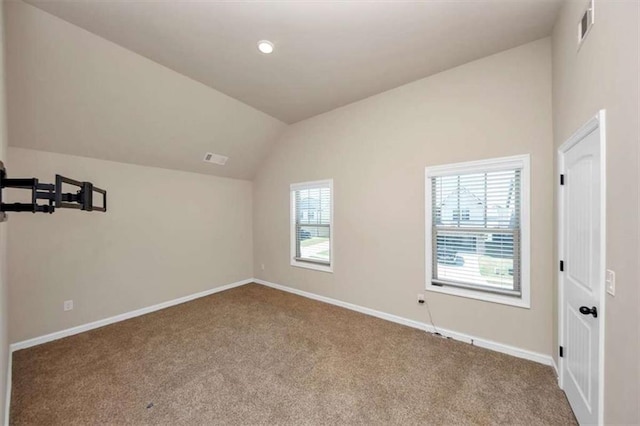 2375 Walker Dr, Hampton, GA 30228 - carpeted empty room featuring visible vents, baseboards, and vaulted ceiling